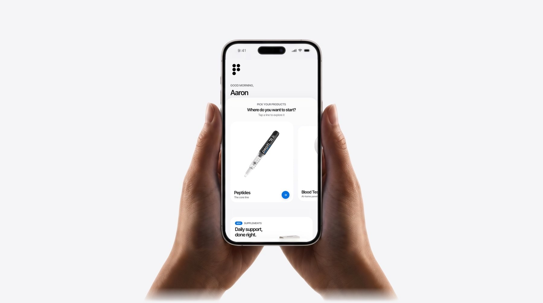 Two hands holding an iPhone showing the pepti app home screen